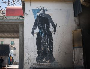 stefano majno israel west bank wall banksy graffiti liberty statue money.jpg.jpg
